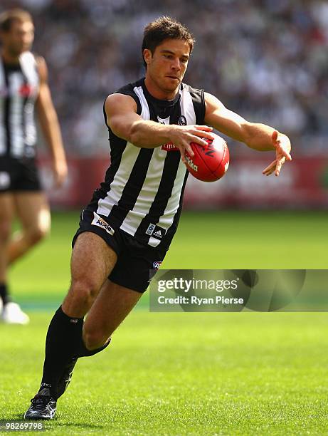 Paul Medhurst of the Magpies prepares to kick during the round two AFL match between the Collingwood Magpies and the Melbourne Demons at the...