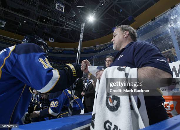 St. Louis Blues team trainer Ray Barile gets a fist bump from Andy McDonald of the St. Louis Blues in the game against the Columbus Blue Jackets on...