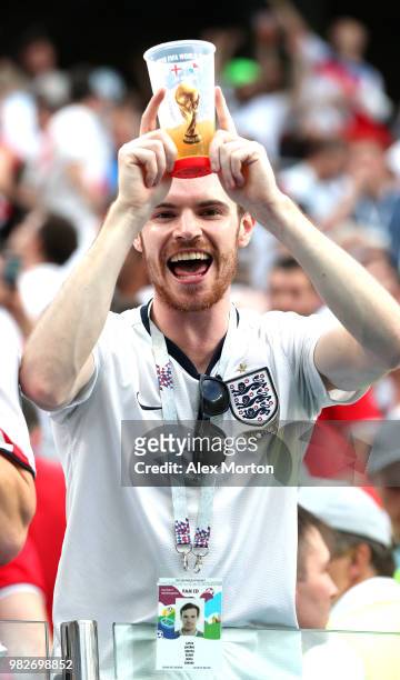 An England fan celebrates with an image of a World Cup Trophy on a pint of beer following England's victory in the 2018 FIFA World Cup Russia group G...
