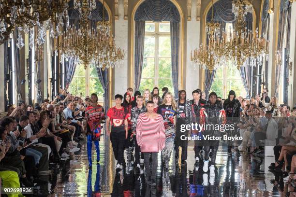 Designer Olivier Rousteing walks the runway with models during the finale of the Balmain Menswear Spring/Summer 2019 show as part of Paris Fashion...