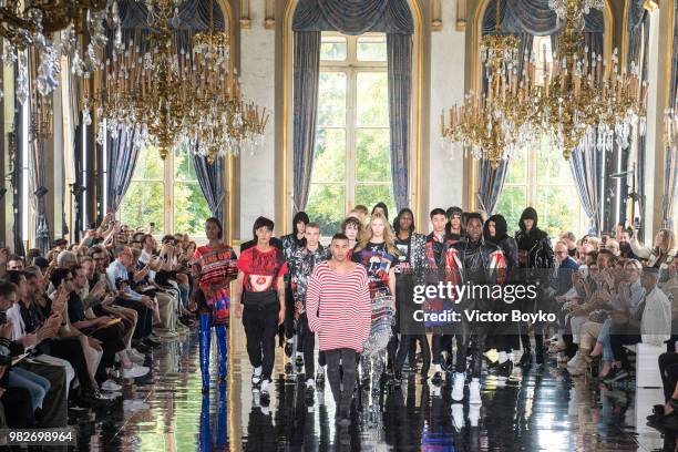 Designer Olivier Rousteing walks the runway with models during the finale of the Balmain Menswear Spring/Summer 2019 show as part of Paris Fashion...