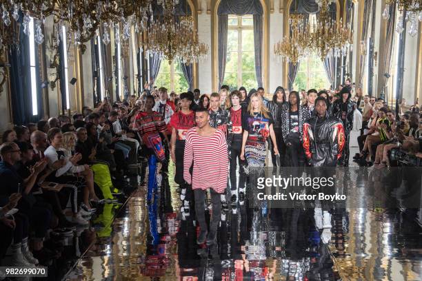 Designer Olivier Rousteing walks the runway with models during the finale of the Balmain Menswear Spring/Summer 2019 show as part of Paris Fashion...
