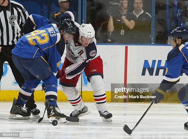 David Backes of the St. Louis Blues faces off against Samuel Pahlsson of the Columbus Blue Jackets on April 5, 2010 at Scottrade Center in St. Louis,...