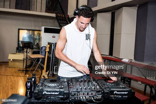 Player Klay Thompson of the Golden State Warriors play sound console with a band on June 24, 2018 in Beijing, China.