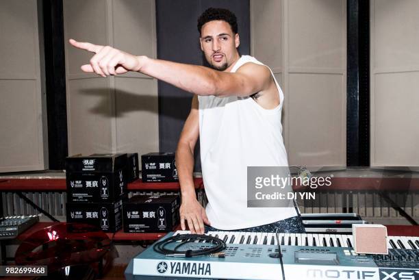 Player Klay Thompson of the Golden State Warriors play electronic piano with a band on June 24, 2018 in Beijing, China.