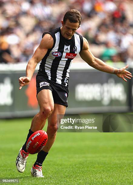 Luke Ball of the Magpies kicks during the round two AFL match between the Collingwood Magpies and the Melbourne Demons at the Melbourne Cricket...