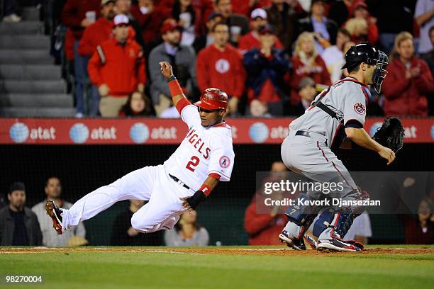 Erick Aybar of the Los Angeles Angels of Anaheim scores their first run of the season on a single by Kendry Morales during their game against the...