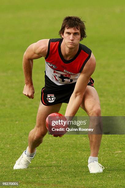 Farren Ray of the Saints handballs during a St Kilda Saints AFL training session at Linen House Oval on April 6, 2010 in Melbourne, Australia.