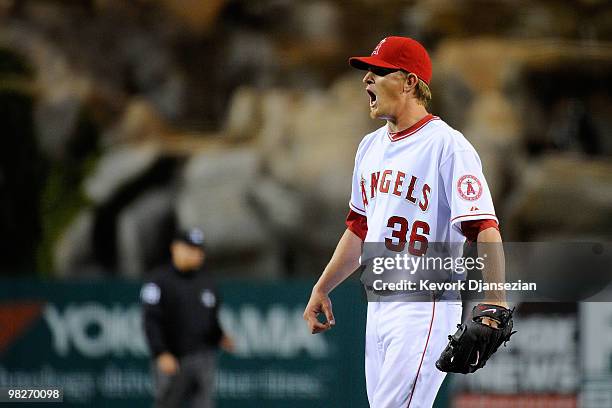 Pitcher Jered Weaver of the Los Angeles Angels of Anaheim reacts in the second inning against the Minnesota Twins in their Opening Day game at Angel...