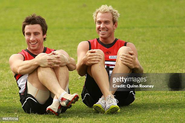 Stephen Milne and Jason Gram of the Saints share a laugh during a St Kilda Saints AFL training session at Linen House Oval on April 6, 2010 in...
