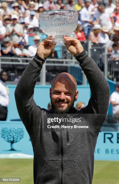 Stefan Olsson of Sweden with the men's wheelchair trophy during Day 7 of the Fever-Tree Championships at Queens Club on June 24, 2018 in London,...