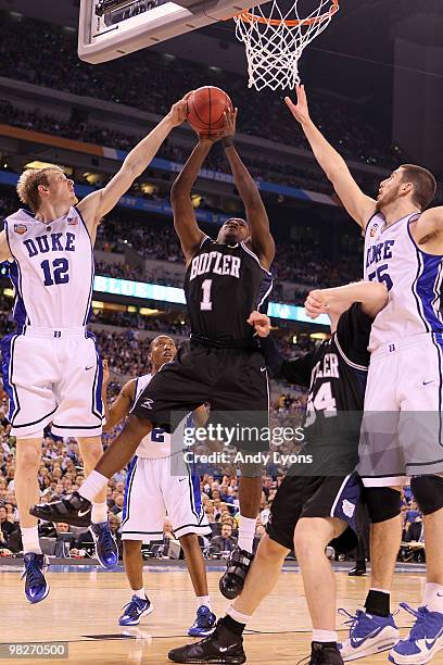 Shelvin Mack of the Butler Bulldogs goes up for a shot against Kyle Singler of the Duke Blue Devils during the 2010 NCAA Division I Men's Basketball...