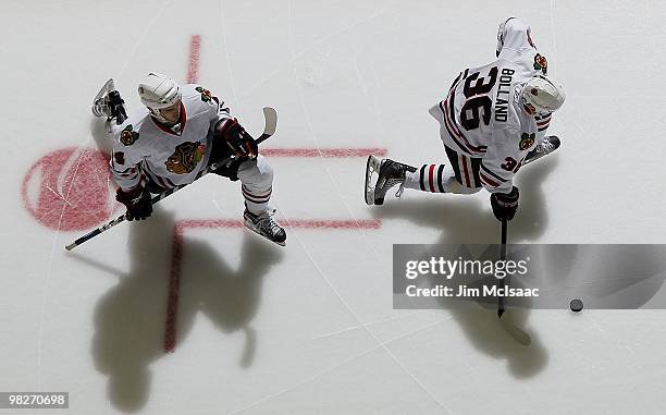 Niklas Hjalmarsson and Dave Bolland of the Chicago Blackhawks warm up before playing against the New Jersey Devils at the Prudential Center on April...