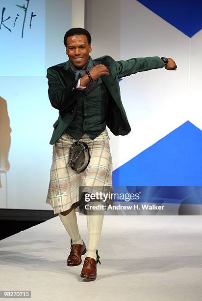 Olympian Shani Davis walks the runway at the 8th annual "Dressed To Kilt" Charity Fashion Show presented by Glenfiddich at M2 Ultra Lounge on April...