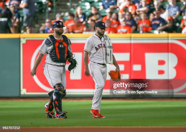 Houston Astros catcher Brian McCann and Houston Astros starting pitcher Lance McCullers Jr. Walk toward the dugout during the baseball game between...