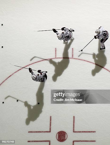 Marian Hossa, Jonathan Toews and Tomas Kopecky of the Chicago Blackhawks warm up before playing against the New Jersey Devils at the Prudential...