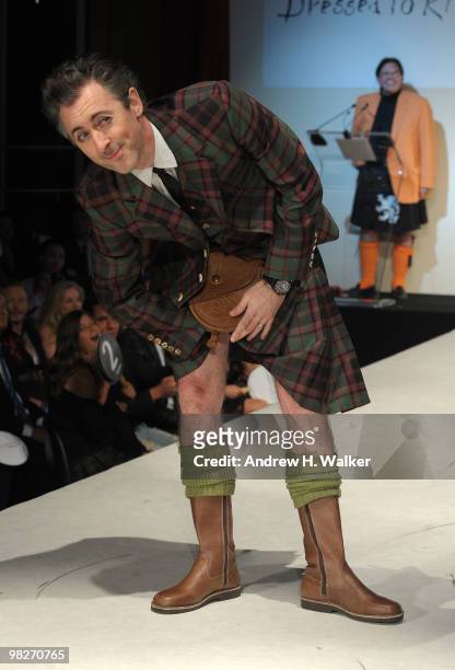 Actor Alan Cumming reaches into his kilt on the runway at the 8th annual "Dressed To Kilt" Charity Fashion Show presented by Glenfiddich at M2 Ultra...