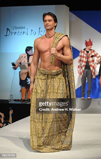 Marcus Schenkenberg walks the runway at the 8th annual "Dressed To Kilt" Charity Fashion Show presented by Glenfiddich at M2 Ultra Lounge on April 5,...