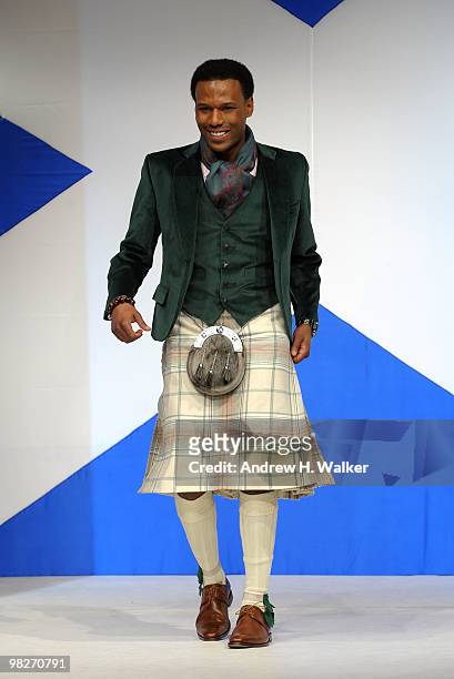 Olympian Shani Davis walks the runway at the 8th annual "Dressed To Kilt" Charity Fashion Show presented by Glenfiddich at M2 Ultra Lounge on April...