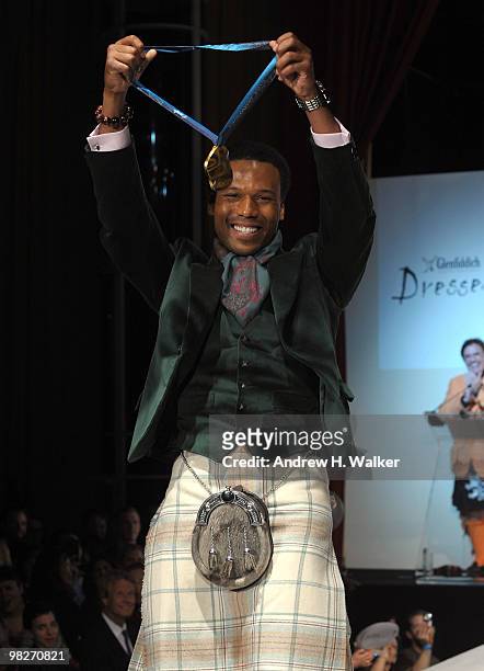 Olympian Shani Davis walks the runway at the 8th annual "Dressed To Kilt" Charity Fashion Show presented by Glenfiddich at M2 Ultra Lounge on April...
