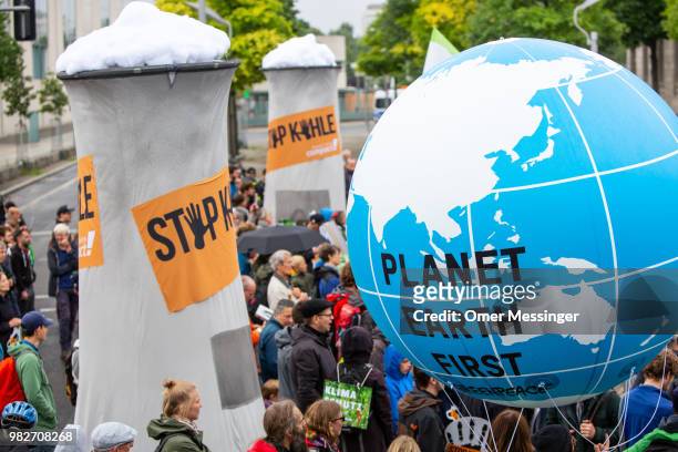 Demonstrators gather to protest against coal-based energy in front of the Chancellery in the "Stop Coal" protest event on June 24, 2018 in Berlin,...