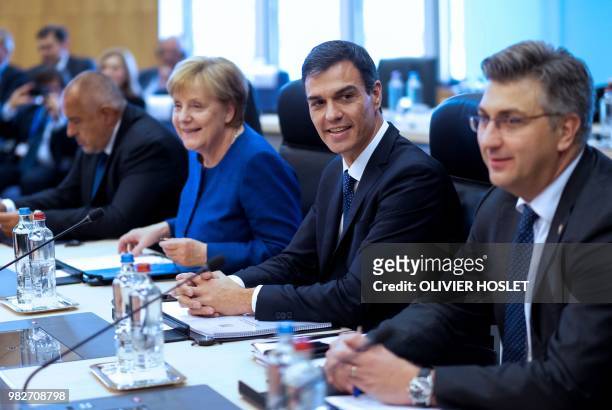 German Chancellor Angela Merkel speaks with Spanish Prime Minister Pedro Sanchez alongside Bulgaria's Prime Minister Boyko Borissov and Croatia's...