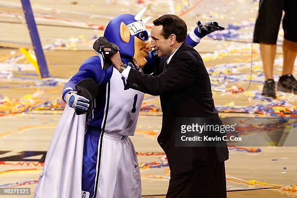 Head coach Mike Krzyzewski and the Duke Blue Devils mascot celebrate after their 61-59 win against the Butler Bulldogs during the 2010 NCAA Division...