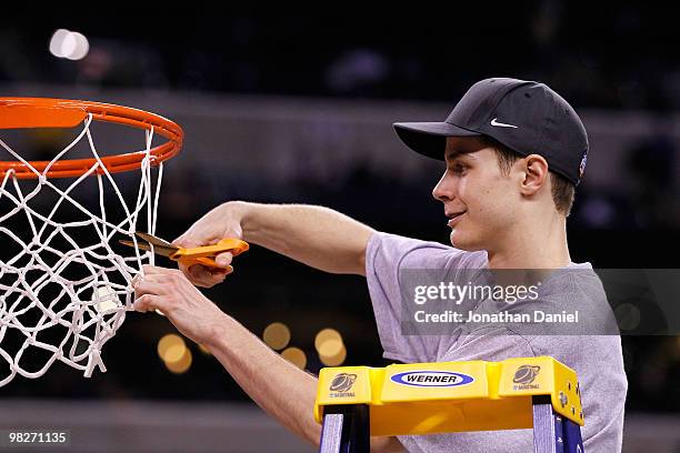 Jon Scheyer of the Duke Blue Devils cuts down a piece of the net following their 61-59 win against the Butler Bulldogs during the 2010 NCAA Division...