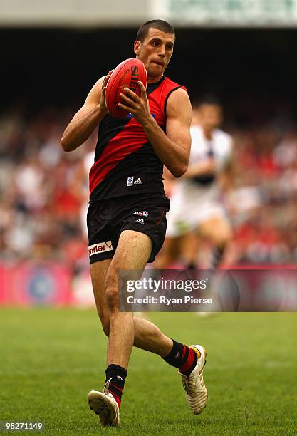 Scott Gumbleton of the Bombers marks during the round two AFL match between the Essendon Bombers and the Fremantle Dockers at Etihad Stadium on April...