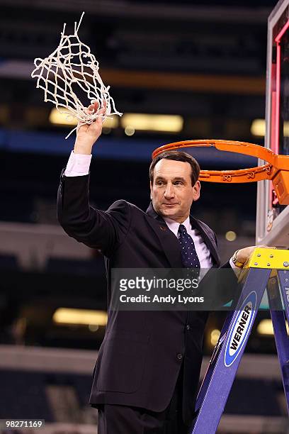 Head coach Mike Krzyzewski of the Duke Blue Devils cuts down a piece of the net following their 61-59 win against the Butler Bulldogs during the 2010...