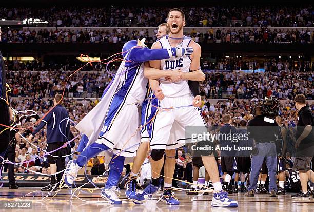 Brian Zoubek of the Duke Blue Devils reacts with teammates and the mascot after the Blue Devils defeat the Butler Bulldogs 61-59 in the 2010 NCAA...