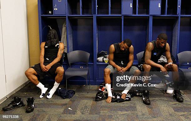 Willie Veasley, Shawn Vanzant and Avery Jukes of the Butler Bulldogs sit in the locker room after losing to the Duke Blue Devils 61-59 in the 2010...