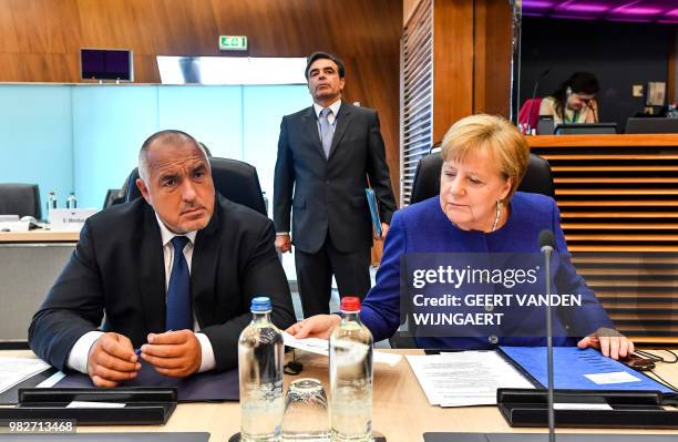German Chancellor Angela Merkel and Bulgarian Prime Minister Boyko Borissov look on during a round table meeting at an informal EU summit on...