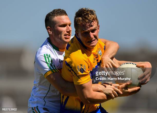 Offaly , Ireland - 24 June 2018; Pearse Lillis of Clare in action against Anton Sullivan of Offaly during the GAA Football All-Ireland Senior...