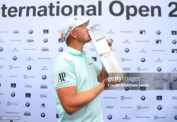 Matt Wallace of England kisses the trophy after winning the BMW International Open at Golf Club Gut Larchenhof on June 24, 2018 in Cologne, Germany.