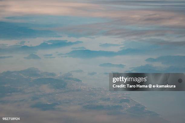 seto inland sea and imabari city in ehime prefecture daytime aerial view from airplane - imabari city stock pictures, royalty-free photos & images