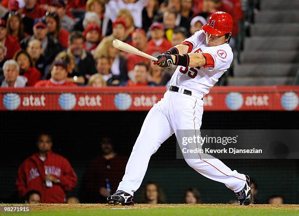 Hideki Matsui of the Los Angeles Angels of Anaheim hits an RBI single to score Erick Aybar during their game against the Minnesota Twins on Opening...