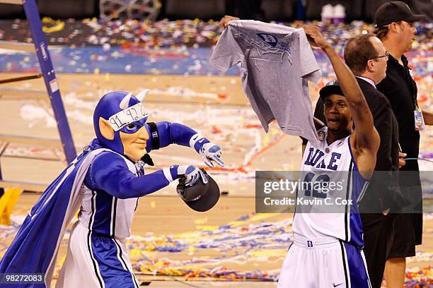 The mascot and Lance Thomas of the Duke Blue Devils celebrate on court after they won 61-59 against the Butler Bulldogs during the 2010 NCAA Division...