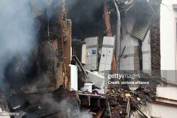 Dpatop - 24 June 2018, Wuppertal, Germany: Smoke rises from the rubble of a house in which there was an explosion during the night. In an explosion...