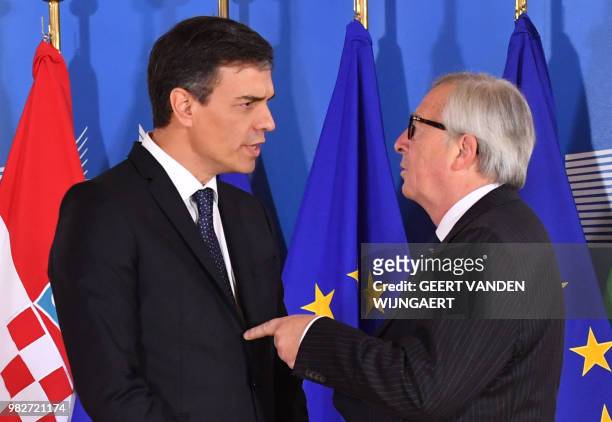 Spanish Prime Minister Pedro Sanchez is welcomed by European Commission President Jean-Claude Juncker ahead of an informal EU summit on migration at...