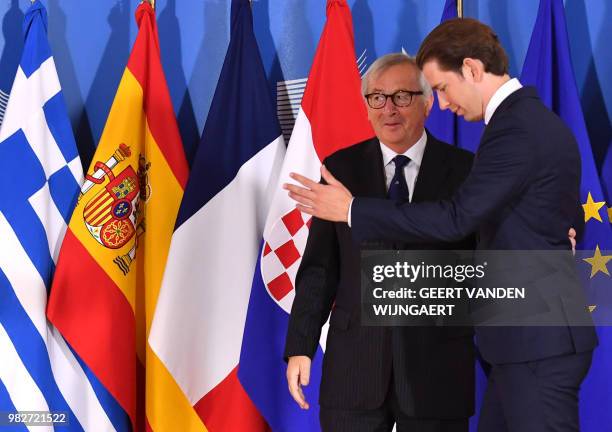 European Commission President Jean-Claude Juncker speaks with Austrian Chancellor Sebastian Kurz ahead of an informal EU summit on migration at the...