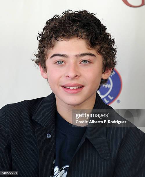 Actor Ryan Ochoa signs posters at an autograph session prior to the premiere of "The Perfect Game" on April 5, 2010 in Los Angeles, California.