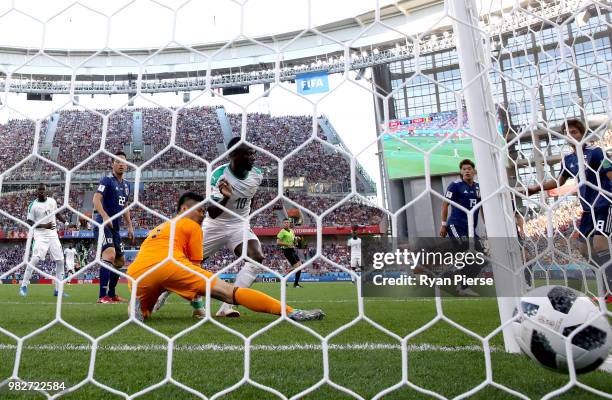 Sadio Mane of Senegal scores his team's first goal past Eiji Kawashima of Japan during the 2018 FIFA World Cup Russia group H match between Japan and...