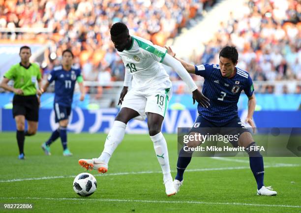 Mbaye Niang of Senegal holds off Gen Shoji of Japan during the 2018 FIFA World Cup Russia group H match between Japan and Senegal at Ekaterinburg...