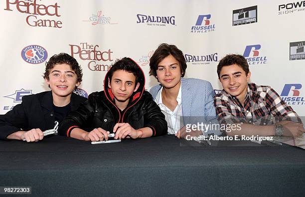 Actor Ryan Ochoa, actor Moises Arias, actor Jake T. Austin and actor Jansen Panettiere sign posters at an autograph session prior to the premiere of...