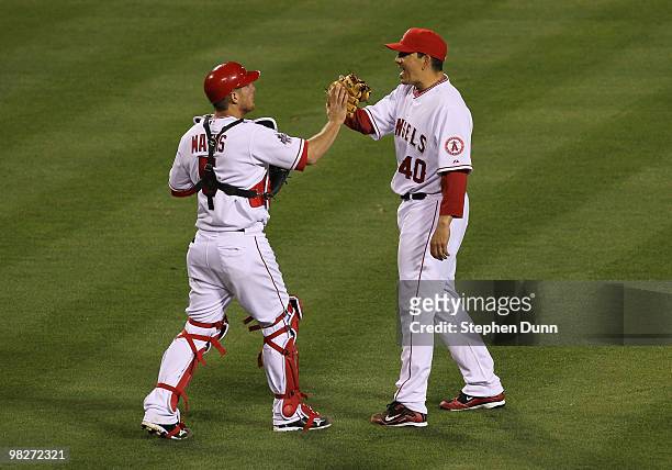 Jeff Mathis and Brian Fuentes of the Los Angeles Angels of Anaheim celebrate their 6-3 win over the Minnesota Twins in their Opening Day game at...