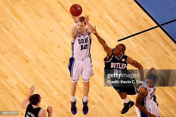 Kyle Singler of the Duke Blue Devils attempts a shot against Willie Veasley of the Butler Bulldogs during the 2010 NCAA Division I Men's Basketball...