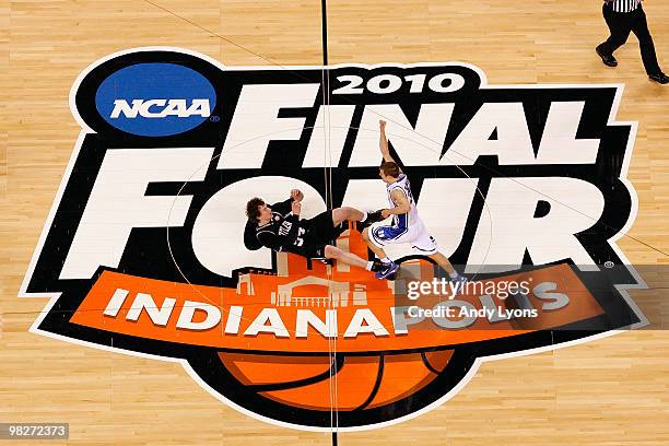 Jon Scheyer of the Duke Blue Devils celebrates after they won 61-59 against Matt Howard of the Butler Bulldogs during the 2010 NCAA Division I Men's...