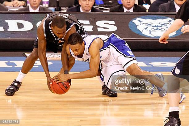 Shelvin Mack of the Butler Bulldogs and Lance Thomas of the Duke Blue Devils battle for the ball during the 2010 NCAA Division I Men's Basketball...