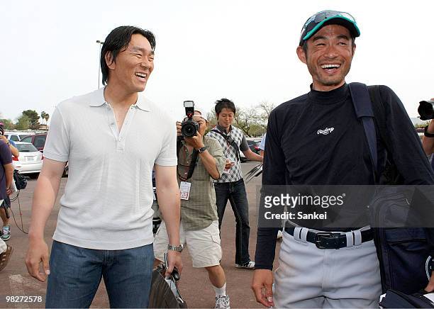 Hideki Matsui of Los Angeles Angels of Anaheim and Ichiro Suzuki of Seattle Mariners talk after a Spring Camp game between Seattle Mariners and Los...